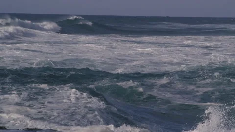 Big violent waves crash and create dangerous turbulent water and rip tides Stock Footage 148345530
