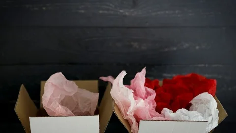 Big vs small budget, different size price tags on delivery parcels and camera Stock Footage 123389051