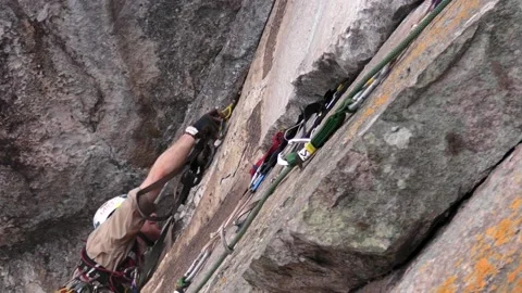 Big Wall Climber Clipping Protection During First Ascent in Malaysia Stock Footage 231711341