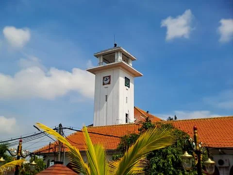 Big wall clock in an old white building in Madiun, East Java, Indonesia, with Stock Photos