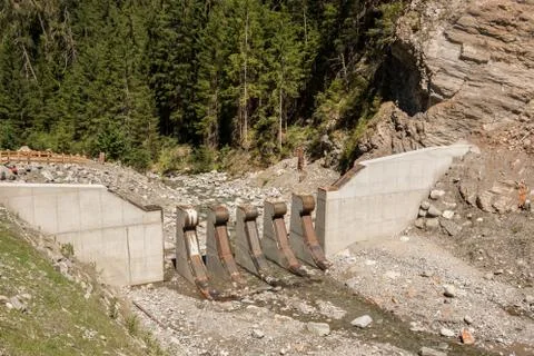 Big walls as protection from rocks and trees that comes with melt water Stock Photos