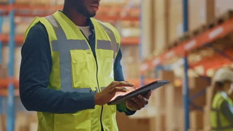 Big Warehouse Worker uses Digital Tablet Stock Footage 139528885