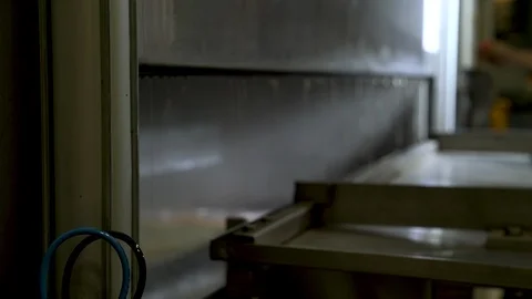 Big washing machine opens, after hot cleaning metal parts from oil. Stock-Footage 111715900