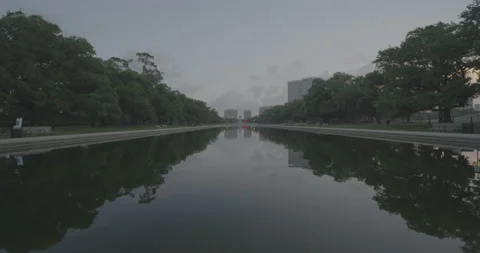 A big water pool with reflection in Hermann park, Houston. Early morning Stock Footage 149326094