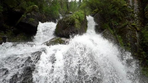 Big waterfall among the mountains Video stock 117798849