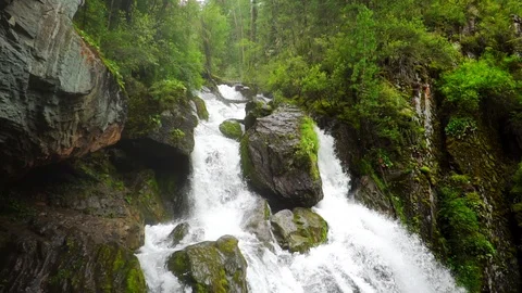 Big waterfall among the mountains Stock Footage 118314318