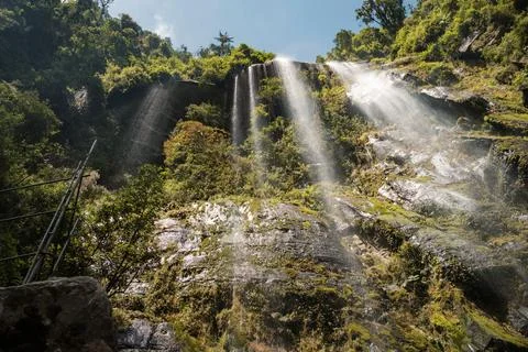 A big waterfall falling down the rocks in Colombia from below Stock Photos