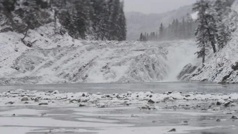 A big waterfall on a river during a cold winter day Stock Footage 150490051