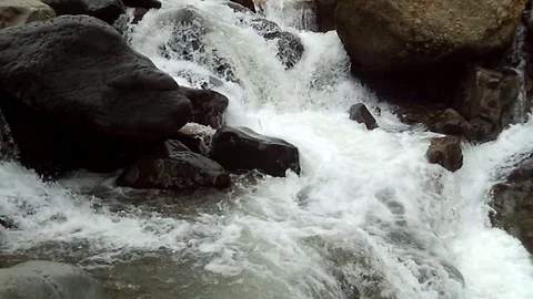 Big waterfall stream on big river on muria mountain, rahtawu Stock Footage 125124612
