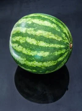 A big watermelon on the black background Stock Photos