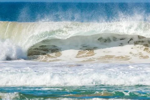 Big wave that breaks on the coast Stock Photos