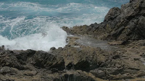 Big wave that completely covers the rocks- slow motion 스톡 동영상 67484745