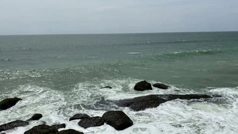 Big wave crashes against the rocks of a rock coast, waves with foam Video stock 167701754