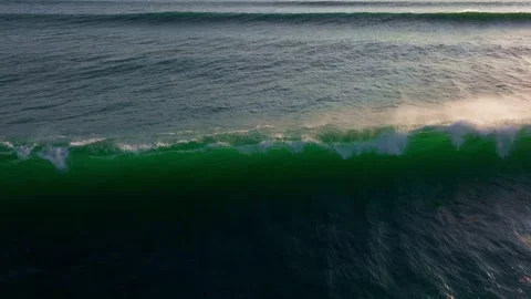 Big wave drone shot, ocean wave in Bali at sunset, barreling waves, surf spot in Stock Footage 251682148
