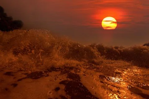 Big wave front with bubbles and splashes Stock Photos