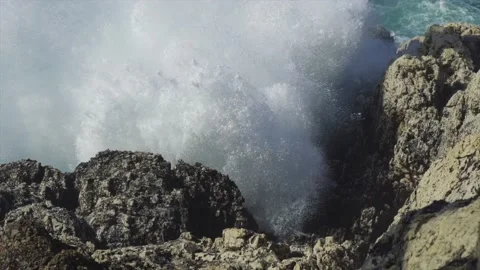 Big wave hitting rocks on coast Stock Footage 168771949