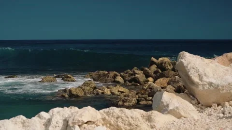 Big wave hitting rocks, white rocky coast Stock Footage 63529198