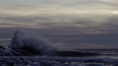 Big wave splash over the rock after sunset Video stock 94683509