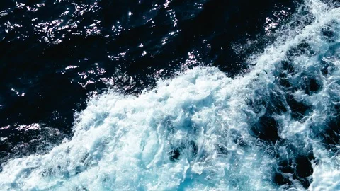 Big Wave Splashing in the Middle of Blue Sea Stock Footage 117445818