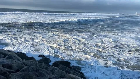 Big waves against a beautiful sky. Beautiful waves on the Portuguese coast Stock Footage 301141013