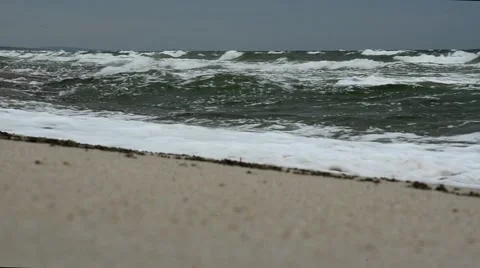 Big waves on the beach of the Curonian Spit. Storm on the sea. Video stock 52342423