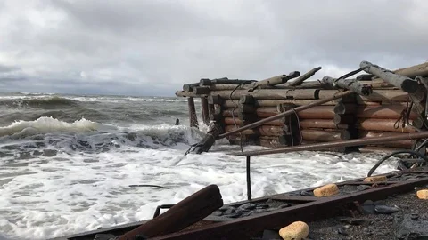 Big waves beat on the old wooden pier in bad weather. Stock Footage 80254666