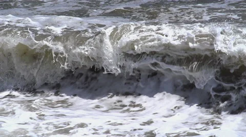 The big waves break against the rocks Stock Footage 53375011