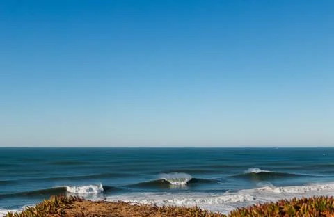 Big Waves break in the Pacific Ocean on a California beach Stock Photos