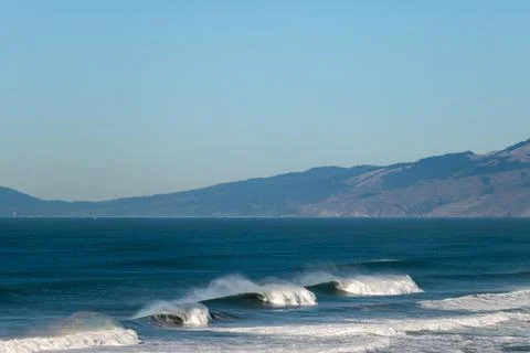 Big Waves break in the Pacific Ocean on a California beach Stock Photos