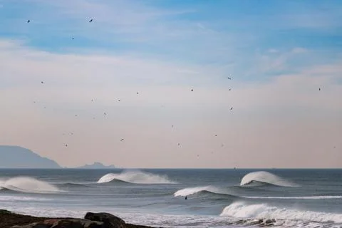 Big Waves break in the Pacific Ocean on a California beach Stock Photos