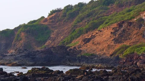 Big waves break on the rocky shore Stock Footage 126839155