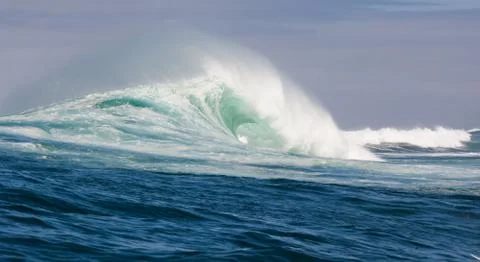 Big waves breaking on an reef along the coast of South Africa Stock Photos
