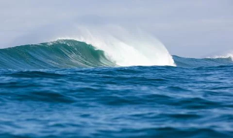 Big waves breaking on an reef along the coast of South Africa Stock Photos