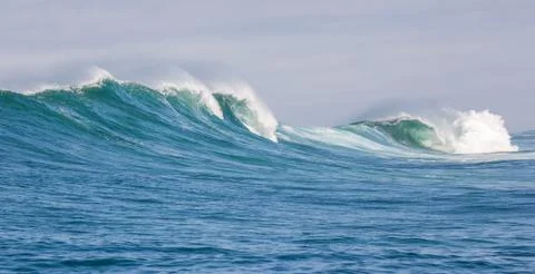 Big waves breaking on an reef along the coast of South Africa Stock Photos