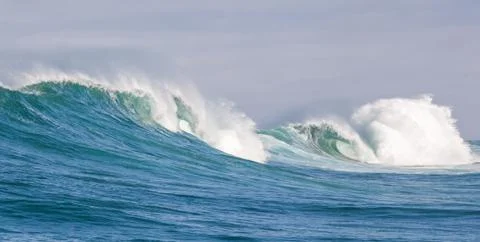Big waves breaking on an reef along the coast of South Africa Stock Photos
