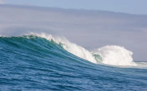 Big waves breaking on an reef along the coast of South Africa Stock Photos