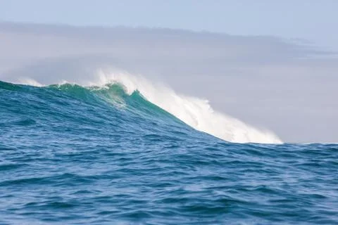 Big waves breaking on an reef along the coast of South Africa Stock Photos