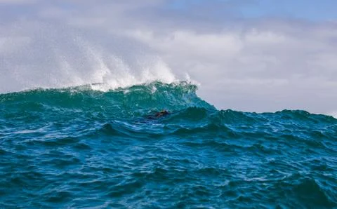 Big waves breaking on an reef along the coast of South Africa Stock Photos
