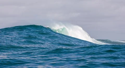 Big waves breaking on an reef along the coast of South Africa Stock Photos