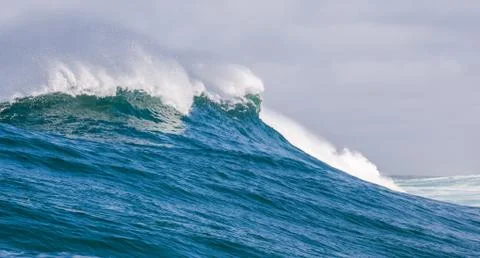 Big waves breaking on an reef along the coast of South Africa Stock Photos