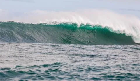 Big waves breaking on an reef along the coast of South Africa Stock Photos