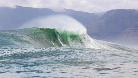 Big waves breaking on an reef along the coast of South Africa Stock Photos