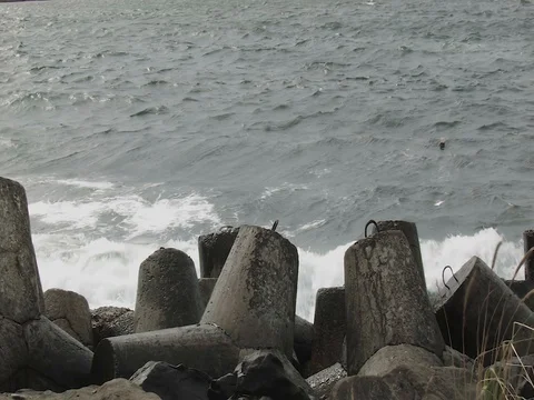 Big waves on the breakwater Stock Footage 80671956