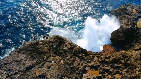 Big waves clashing rocks/mountain creating an awesome big splash 2 Stock Footage 84051809