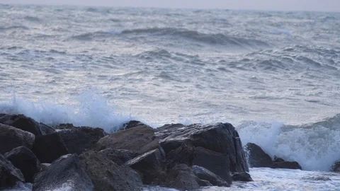 Big waves on the cliffs slow motion Stock Footage 99456051