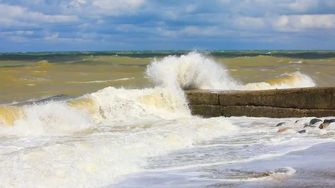 Big waves crash on the pier. Storm on the west coast of Crimea. Black Sea. Stock Footage 114273108