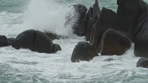 Big waves crash into rocks on sea shore Stock Footage 237298566