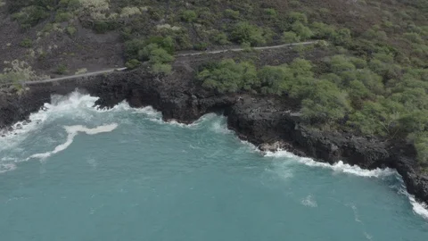Big waves crashing into cliffs and rocks in Hawaii. Drone shot Stock Footage 124441741