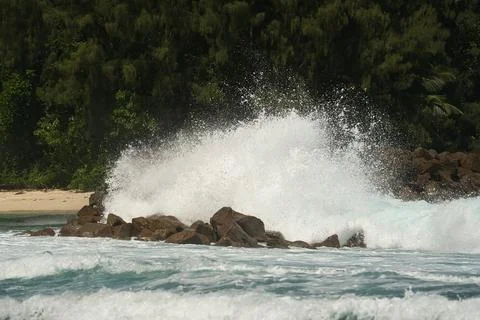 Big waves crusing on huge granite stones on Mahe island, Seychelles 3 Stock Photos