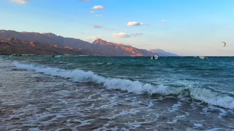 Big waves on Dahab Beach with Kite Surfer on the horizon in Red Sea and Sinai Mo Stock Footage 333247040